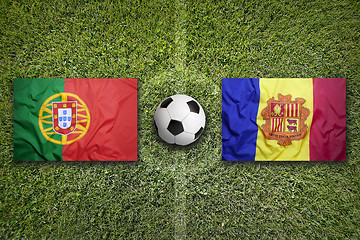 Image showing Portugal and Andorra flags on soccer field