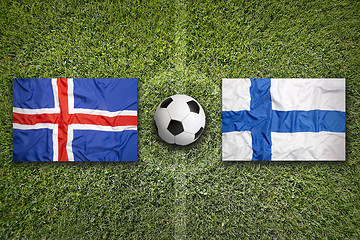 Image showing Iceland and Finland flags on soccer field