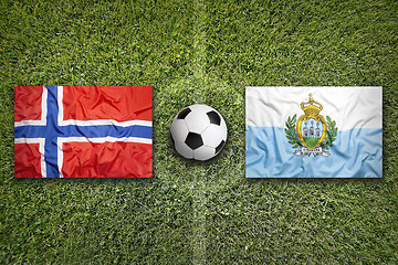 Image showing Norway vs. San Marino flags on soccer field