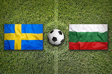 Image showing Sweden vs. Bulgaria flags on soccer field