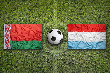 Image showing Belarus vs. Luxembourg flags on soccer field