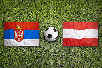 Image showing Serbia vs. Austria flags on soccer field