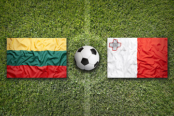 Image showing Lithuania vs. Malta flags on soccer field