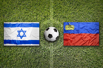 Image showing Israel vs. Liechtenstein flags on soccer field