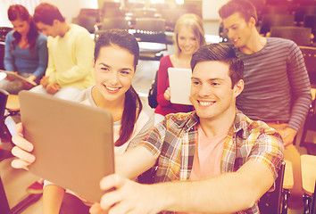 Image showing group of smiling students with tablet pc