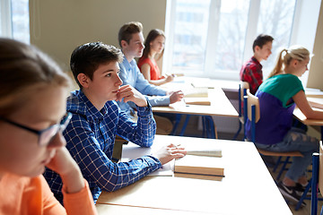 Image showing group of students with books at school lesson