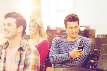 Image showing group of smiling students in lecture hall