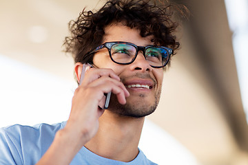 Image showing man with smartphone calling on city street