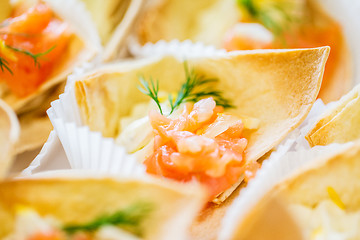 Image showing close up of dough cornet with salmon fish filling