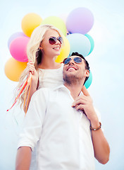 Image showing couple with colorful balloons