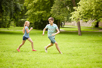 Image showing happy kids running and playing game outdoors