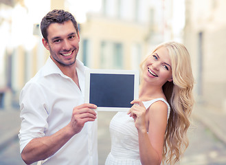 Image showing couple with tablet pc in the city