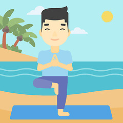 Image showing Man practicing yoga tree pose on the beach.