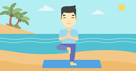 Image showing Man practicing yoga tree pose on the beach.