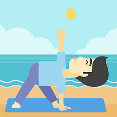 Image showing Man practicing yoga triangle pose on the beach.