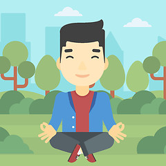 Image showing Businessman meditating in lotus position.