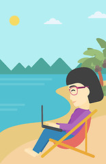 Image showing Business woman working on laptop on the beach.