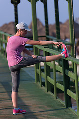 Image showing woman  stretching before morning jogging