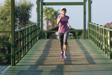 Image showing sporty woman jogging