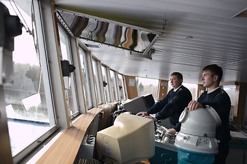 Image showing Captain driving the ship on the river.