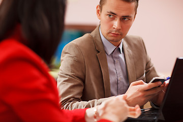 Image showing Businessman listening to a colleague