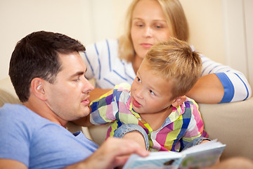 Image showing Father reading to his young son