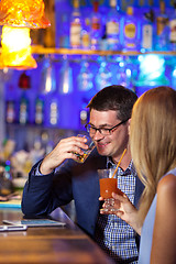 Image showing Handsome man enjoying drinks with a woman