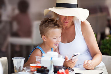 Image showing Grandmother and Grandson Using Cell Phone Together