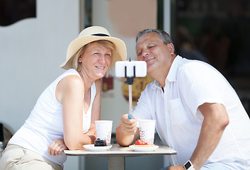 Image showing Adult couple taking selfie with cell phone