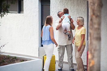 Image showing Grandfather greeting his young grandchild