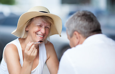 Image showing Smiling happy woman relaxing with her husband