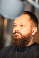 Image showing Attractive bearded man in a barber shop