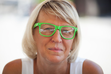 Image showing Middle-aged woman wearing trendy eyeglasses