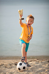 Image showing Young Boy Celebrating Championship Soccer Win