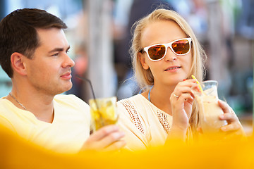 Image showing Young couple relaxing with refreshing drinks