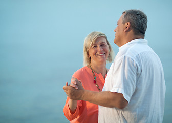 Image showing Middle-aged couple dancing on a romantic song