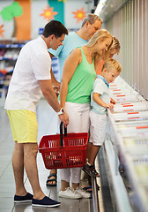 Image showing Family shopping together in a supermarket