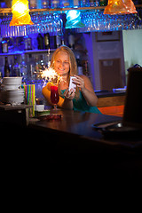 Image showing Attractive woman celebrating in a night club