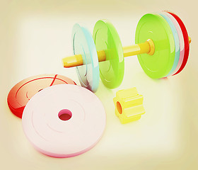 Image showing Colorful dumbbells are assembly and disassembly on a white backg