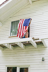Image showing Unrecognizable girl in underwear holding spreaded american flag