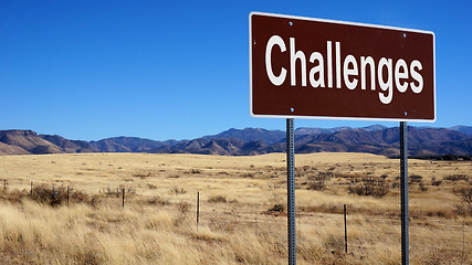 Image showing Challenges brown road sign