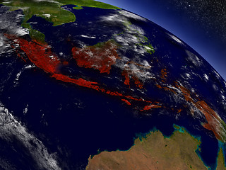 Image showing Indonesia from space highlighted in red