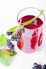 Image showing Glass of aronia juice with berries