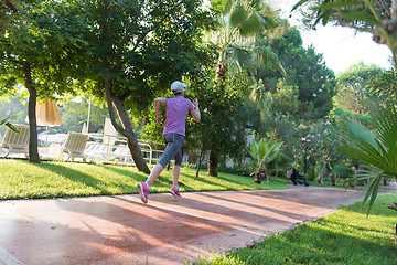 Image showing sporty woman jogging