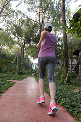 Image showing sporty woman jogging