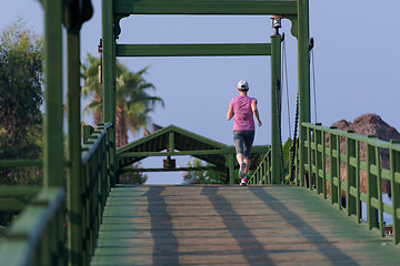 Image showing sporty woman jogging