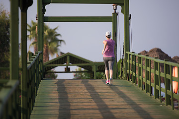 Image showing sporty woman jogging