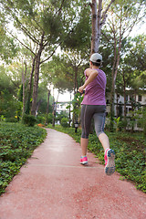 Image showing sporty woman jogging