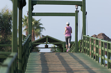 Image showing sporty woman jogging