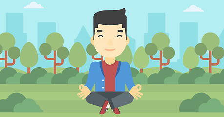 Image showing Businessman meditating in lotus position.